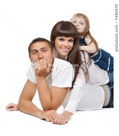 Happy family looking at the camera on their floor Happy family looking at the camera on their floor 5490478