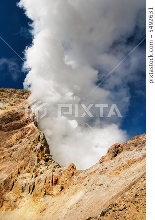 Gases cloud over volcanic crater 5492631