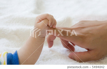 Baby hand holding fingers Baby hand holding fingers 5494842