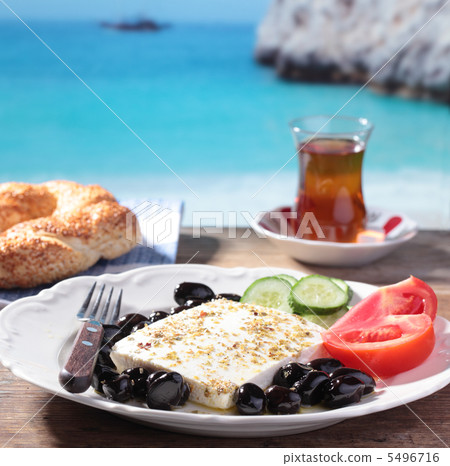 Turkish breakfast against a beach Turkish breakfast against a beach 5496716