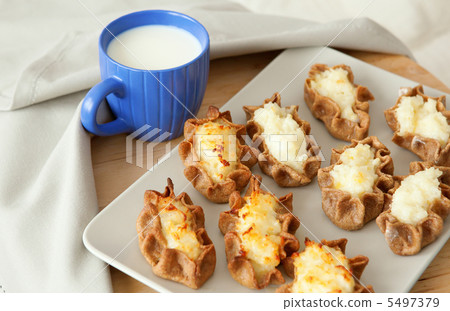 Traditional karelian pasties and cup of milk Traditional karelian pasties and cup of milk 5497379