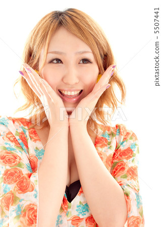 A pretty woman with a smile that looks very happy A pretty woman with a smile that looks very happy 5507441