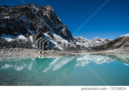 Mountains and Sacred Lake near Gokyo in Himalayas Mountains and Sacred Lake near Gokyo in Himalayas 5510624
