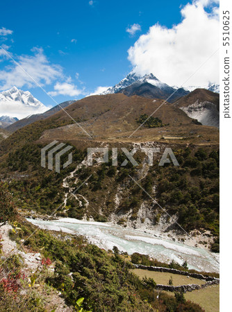 Himalayas: stream and Lhotse, Lhotse shar peaks 5510625