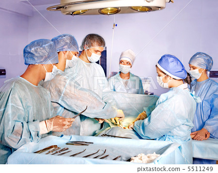 Woman on gurney in operating room. Woman on gurney in operating room. 5511249