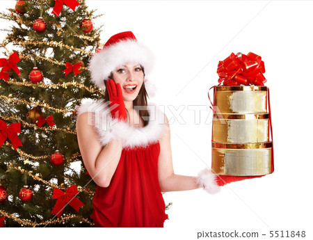 Christmas girl in santa hat holding stack  gift box. 5511848