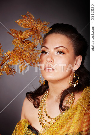 Beautiful young woman with flower. 5512020