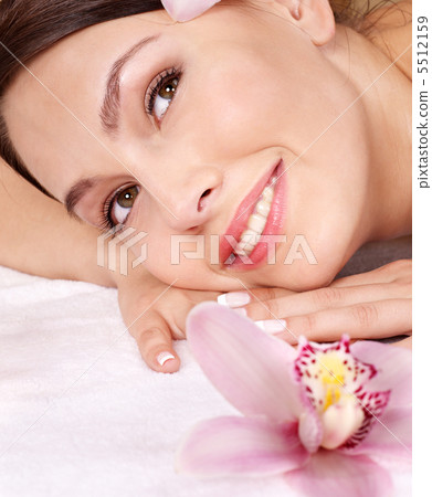 Young woman on massage table in beauty spa. Young woman on massage table in beauty spa. 5512159