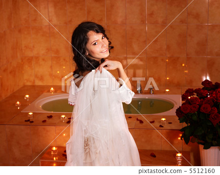 Woman in  wedding dress relaxing in bath. 5512160