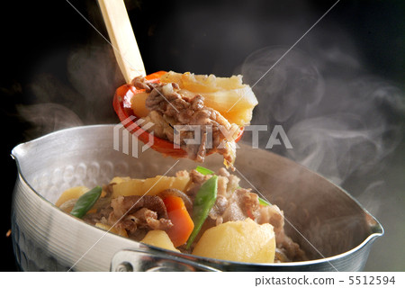 Nikujaga scooped from a pan with a chamoji Nikujaga scooped from a pan with a chamoji 5512594