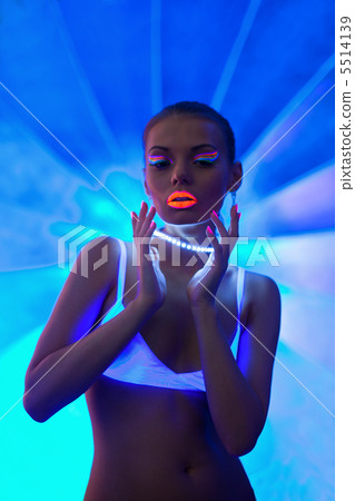 Sexy girl portrait with glow neon make-up Sexy girl portrait with glow neon make-up 5514139