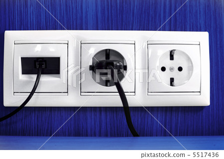 Plugs in electric and phone  socket. 5517436