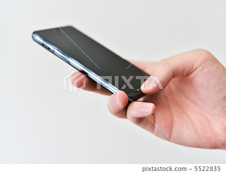 Hand with smartphone Hand with smartphone 5522835