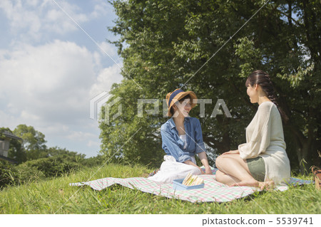 Women resting on the meadow 5539741