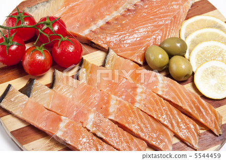 close-up of smoked salmon on wooden plate close-up of smoked salmon on wooden plate 5544459
