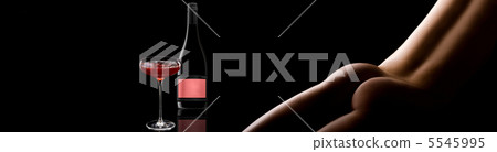 Beautiful girl curves and a glass of alcoholic 5545995