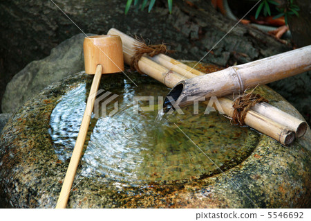 Shishi-odoshi in the Japanese garden 5546692