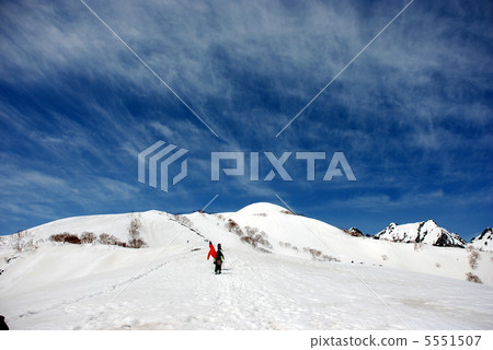 Climbing a snowy mountain 5551507