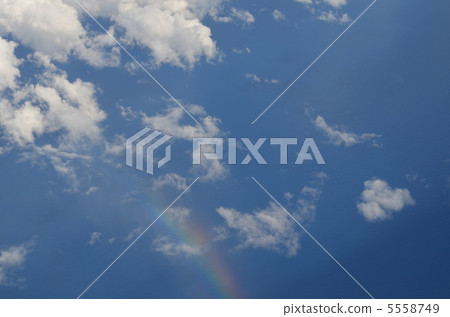 A rainbow that was visible from the window of the plane 5558749