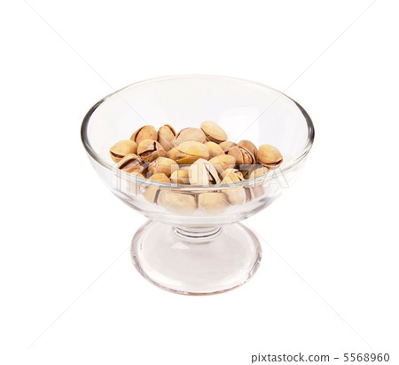 pistachio nuts in a glass bowl 5568960