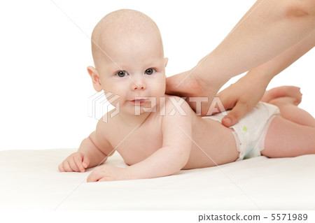 mother massaging her baby boy mother massaging her baby boy 5571989
