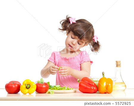 Little kid preparing vegetables for salad. Concept of healthy fo Little kid preparing vegetables for salad. Concept of healthy fo 5572925