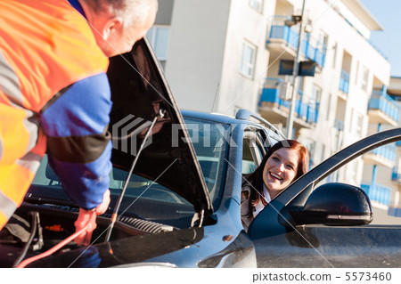 Car troubles woman starting broken vehicle Car troubles woman starting broken vehicle 5573460