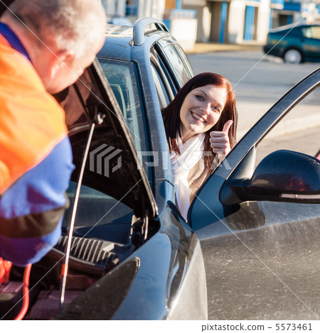 Mechanic fixing car happy woman thumb up Mechanic fixing car happy woman thumb up 5573461