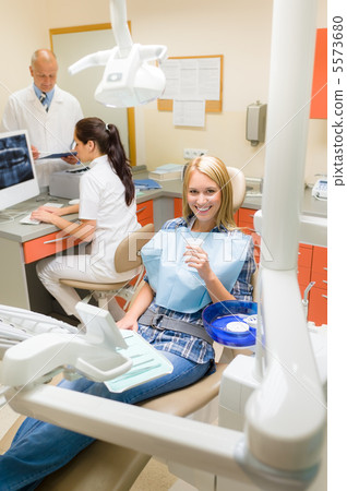 Happy patient woman at dental surgery 5573680