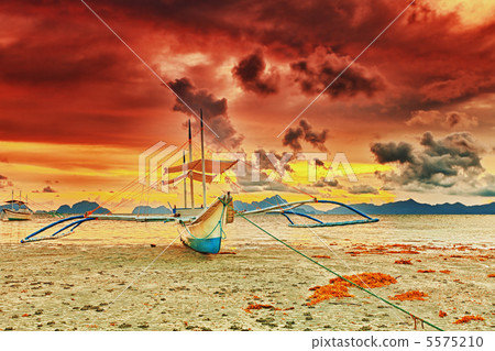 Boat at sunset 5575210