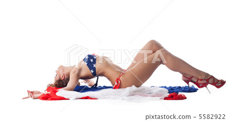 Smiling young woman in bikini with fabric Smiling young woman in bikini with fabric 5582922