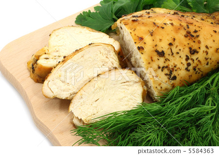 Baked chicken on wooden board close-up Baked chicken on wooden board close-up 5584363