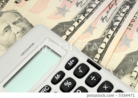 Calculator on money background 5584471