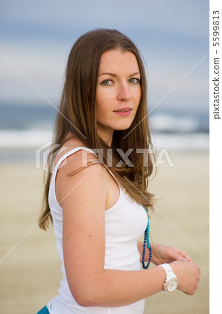 Portrait of beautiful brunette woman in white tank 5599813