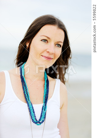 Portrait of beautiful brunette woman in white tank 5599822
