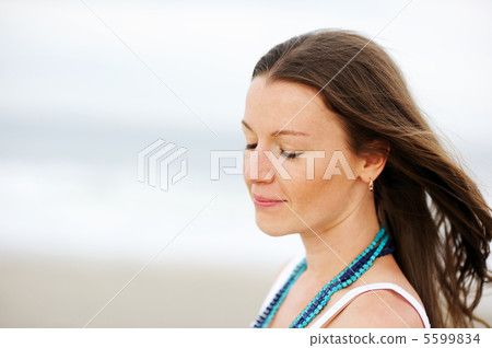 Portrait of beautiful brunette woman dreaming 5599834