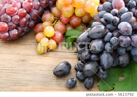 Black grapes and pink tassels. Black grapes and pink tassels. 5613792