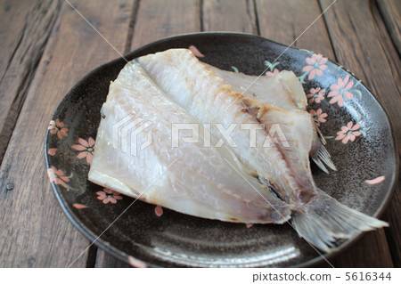 Filleted, uncooked potfish on a Japanese plate. Dried fish. Filleted, uncooked potfish on a Japanese plate. Dried fish. 5616344