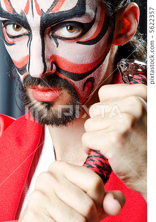 Man with face mask and sword Man with face mask and sword 5622357