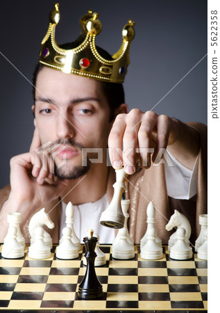 Chess player playing his game Chess player playing his game 5622358