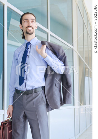 Young businessman on the street Young businessman on the street 5622360