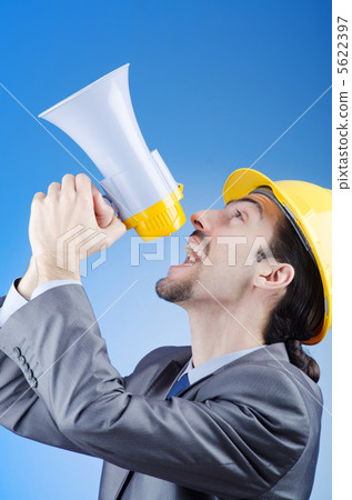 Construction worker shouting via loudspeaker Construction worker shouting via loudspeaker 5622397