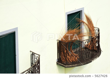 Balcony at old house in Madeira with package of wicker Balcony at old house in Madeira with package of wicker 5627426