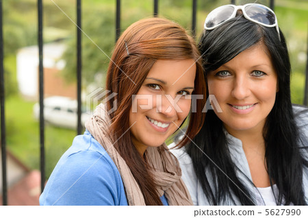 Mother and daughter smiling relaxing and bonding 5627990