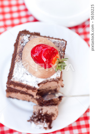 beautiful cake with strawberry and tea on plaid fabric beautiful cake with strawberry and tea on plaid fabric 5630225