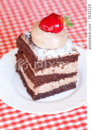 beautiful cake with strawberry on plaid fabric beautiful cake with strawberry on plaid fabric 5630228