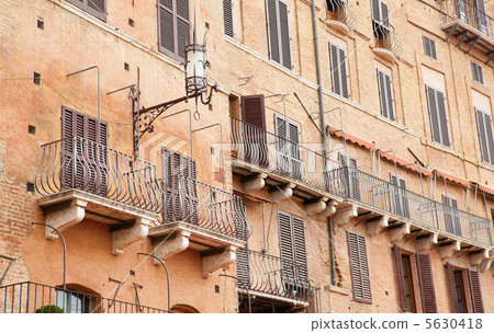Wall with traditional balconies in Sienna, Italy Wall with traditional balconies in Sienna, Italy 5630418