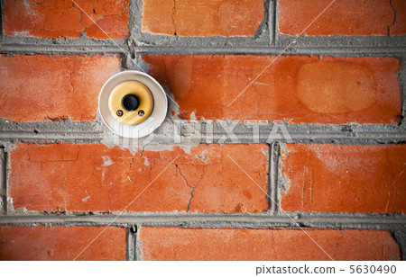 Old doorbell on the brick wall 5630490