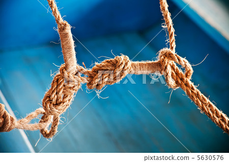 Close up ship ropes with a knot Close up ship ropes with a knot 5630576