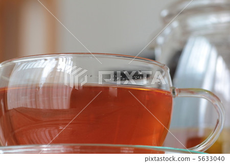 Black tea brewed in a heat-resistant glass teacup Black tea brewed in a heat-resistant glass teacup 5633040
